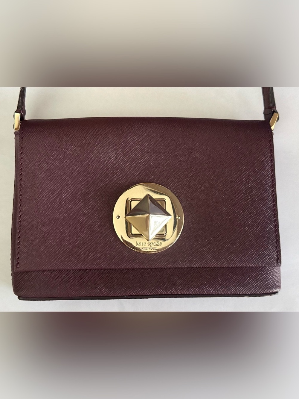 Kate Spade Newbury Lane Sally crossbody bag in mulled wine-colored cow leather
